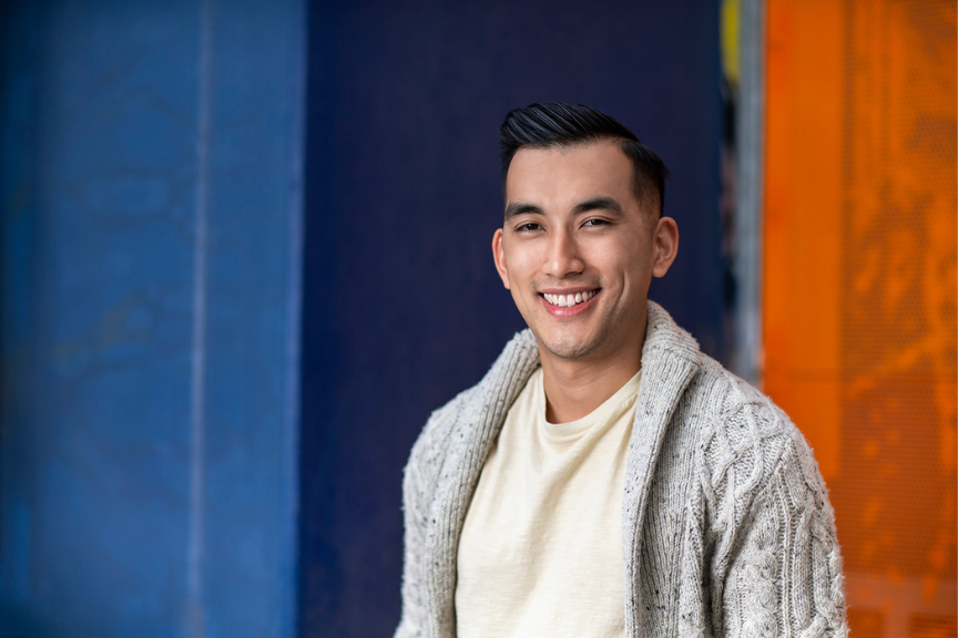A portrait photograph of Michael Lim smiling to camera