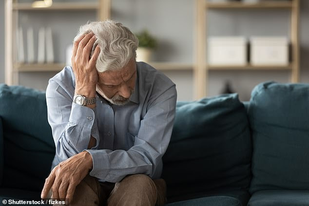 An estimated 850,000 people in the UK suffer from dementia, of whom more than half have Alzheimer¿s. Pictured, shutterstock of a depressed man