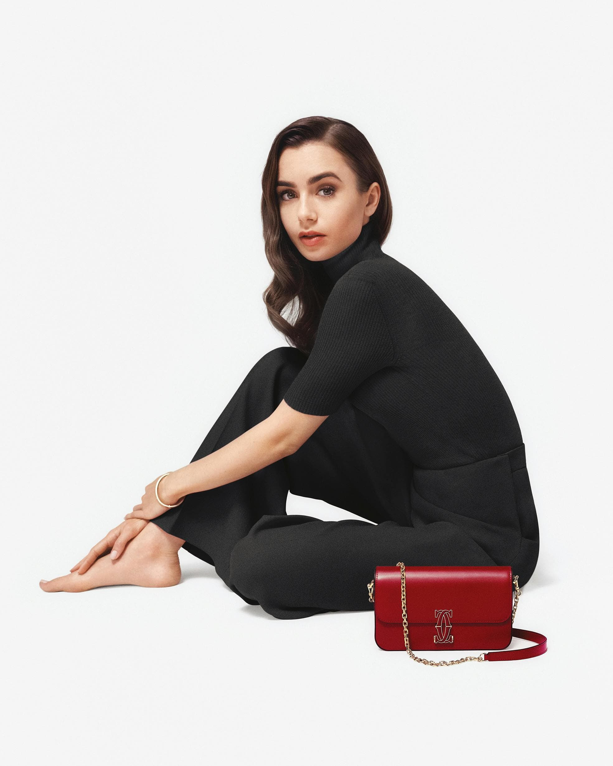 clothing apparel person human sitting sleeve