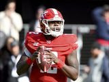 DC Defenders quarterback Cardale Jones (12) looks to throw a pass against the Seattle Dragons during the first half of an XFL football game, Saturday, Feb. 8, 2020, in Washington. (AP Photo/Will Newton)