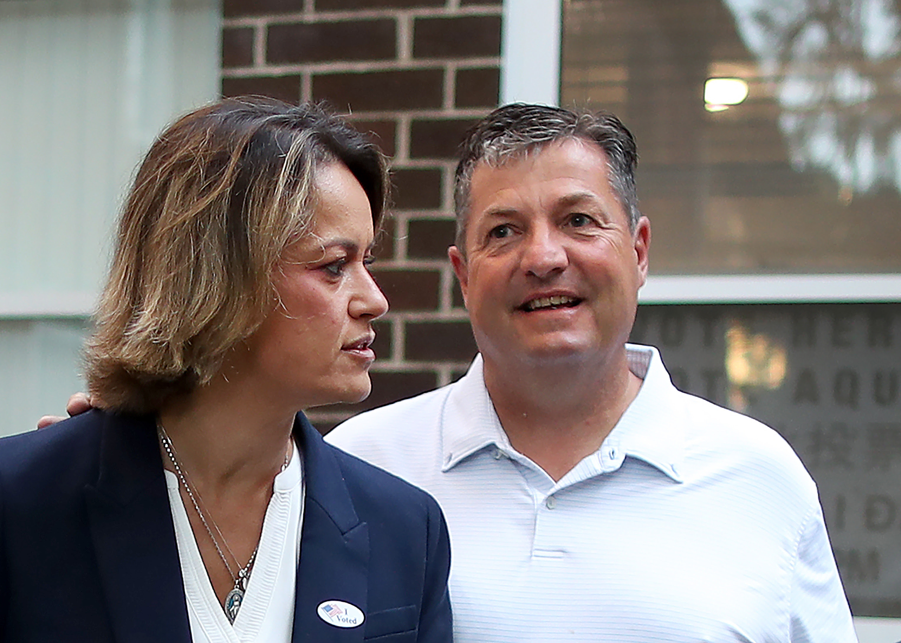 Douglas George with his wife, Annissa Essaibi George, after she voted in the preliminary election.