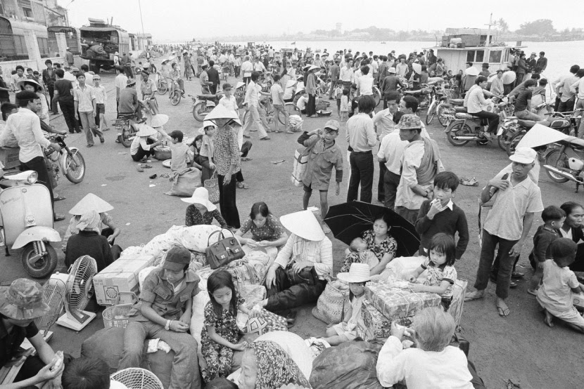 Nowhere to go and nothing to do, South Vietnamese refugees from Hue and the northern provinces pause on the dock waiting for the government to relocate them to the central coastal area at Da Nang in Vietnam, March 28, 1975. (AP Photo/Phuoc)