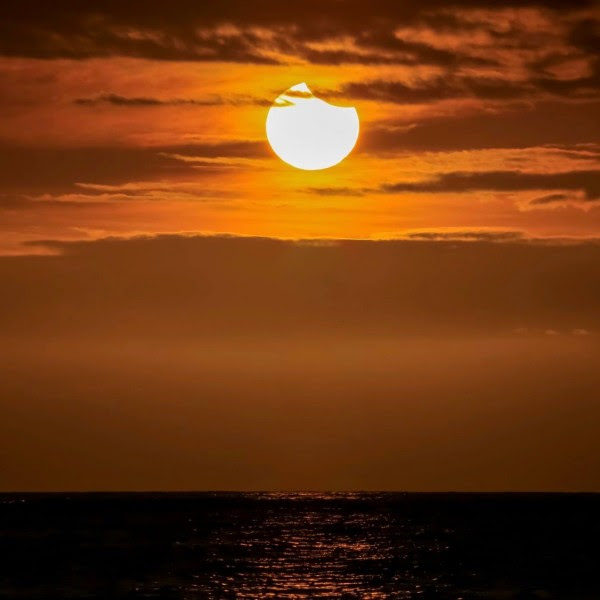 It was a partial solar eclipse sunset from the Big Island of Hawaii on March 8, 2016, said Chris Tinker.  Thanks, Chris!