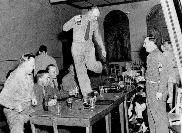 American soldier dancing on a table