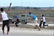 Arabs breach the Gaza security fence and attack IDF patrol jeeps with rocks.
