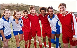 The figure shows a group of male and female high school soccer players smiling at the camera.