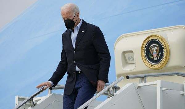 President Joe Biden exits Air Force One as he arrives in Fort Campbell, Ky., Wednesday, Dec. 15, 2021, to survey storm damage from tornadoes and extreme weather. (AP Photo/Andrew Harnik)