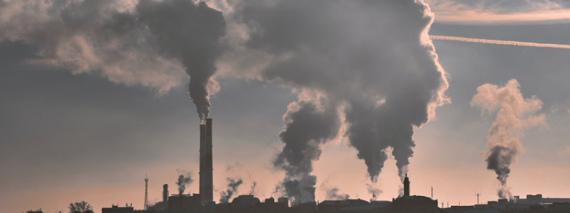 Photo of stacks producing pollution.