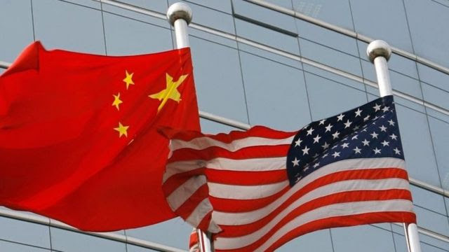 Flags of China (left) and the US. File photo