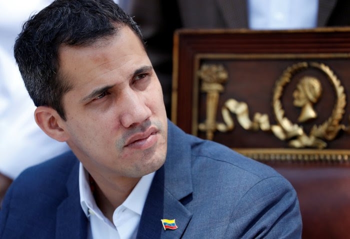 Venezuelan opposition leader Juan Guaido, who many nations have recognized as the country's rightful interim ruler, attends a news conference in Caracas