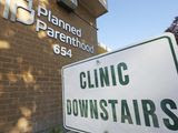 In this Aug. 21, 2019 file photo, a sign is displayed at Planned Parenthood of Utah in Salt Lake City. Senate Republicans have set up votes on two bills in the last week of February that would criminalize some abortion procedures after 20 weeks of pregnancy. The vote could put Democrats on the spot about how far they would go in supporting abortion rights. (AP Photo/Rick Bowmer)