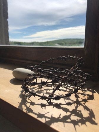 A piece of barbed wire that Matthew Diebel found as a boy still sits on the windowsill of his family house on the British island of Alderney. by the Forward
			