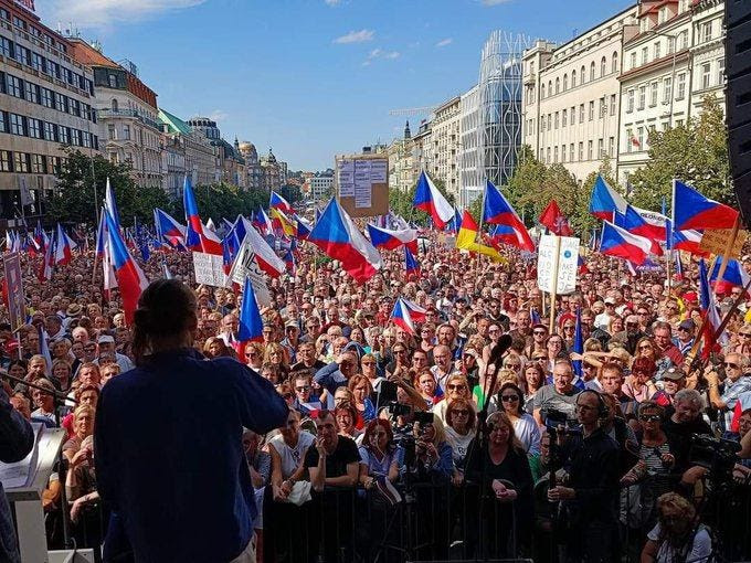 May be an image of one or more people, people standing and outdoors