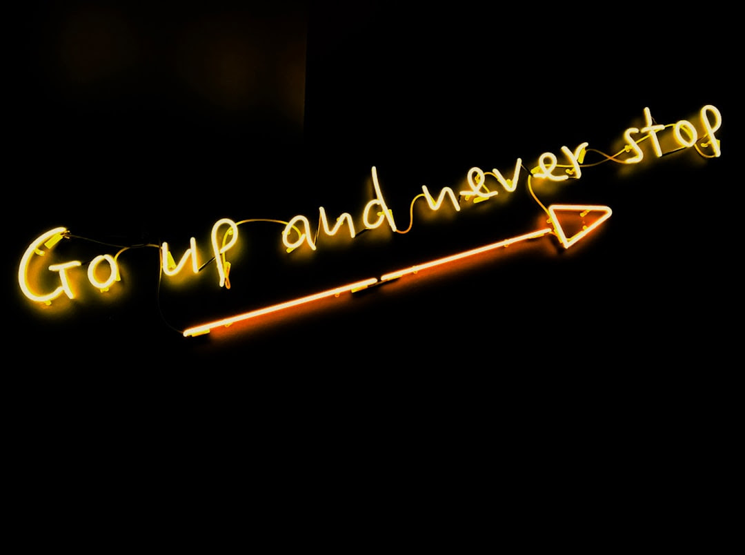 Neon sign: Go Up And Never Stop