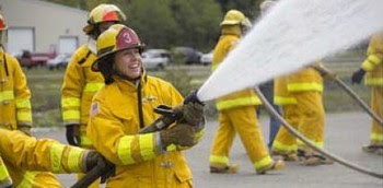 Photo of Amy Scarton participating in firefighting training 