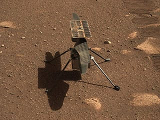 Ingenuity Mars Helicopter with its shadow on Mars.