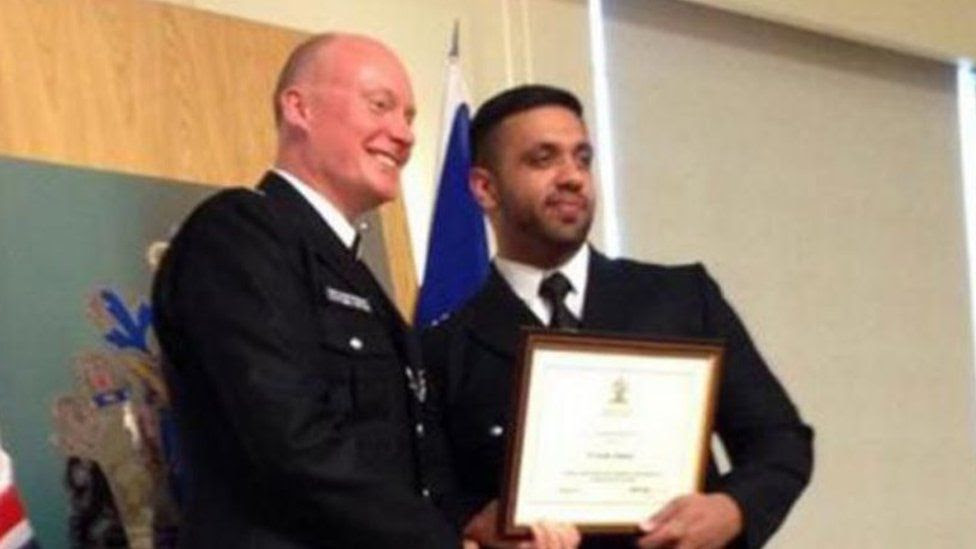 Kashif Mahmood receiving a police commendation