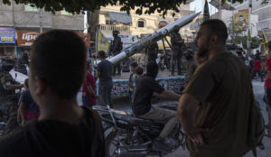Palestinian Islamic Jihad flaunts replicas of rockets in Gaza street parade