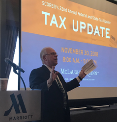 Mark S. Hayward gives opening remarks at SCORE's tax seminar.