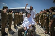 Holocaust survivors from mental health hospitals arrive to celebrate their belated bar mitzvah at the Western Wall, Judaism's holiest site, in Jerusalem's Old City, in 2014.