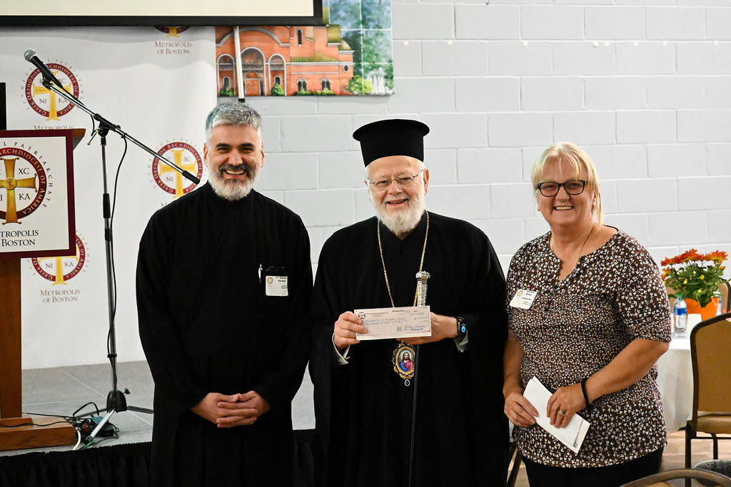 The Philoptochos of the Annunciation parish of Brockton, MA, presented a check for ten thousand dollars to Metropolitan Methodios for the renovation of a building at the Camp Center. (Photo provided by the Metropolis of Boston) ΒΟΣΤΩΝΗ-ΚΛΗΡΙΚΟΛΑΪΚΗ-5jpg