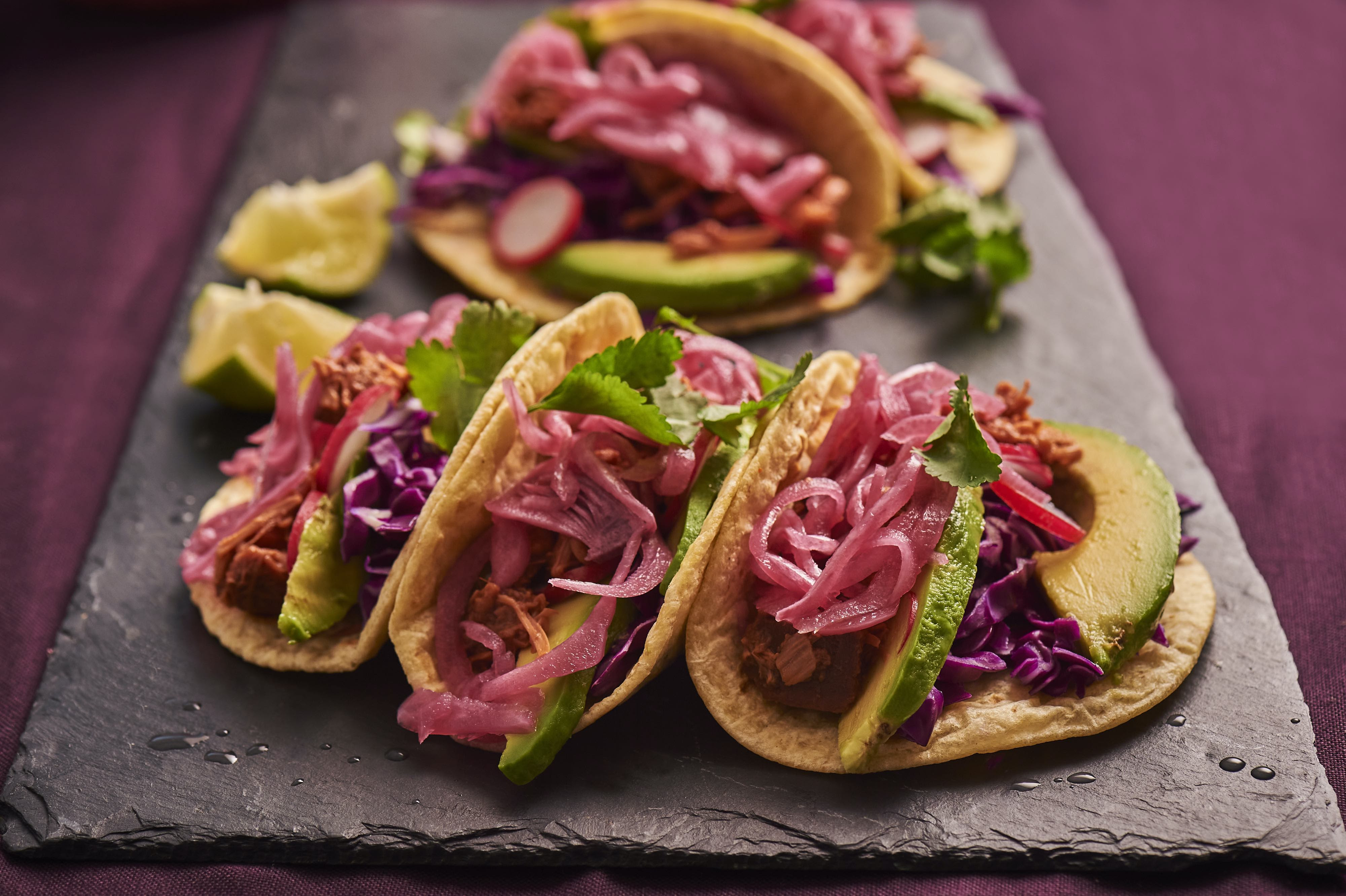 Pulled jackfruit tacos finished with red onion.jpg