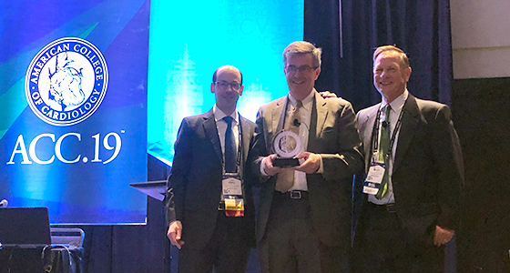 Dr. Gerard Martin accepts an award before delivering the 2019 Dan G. McNamara Keynote lecture at ACC.19.