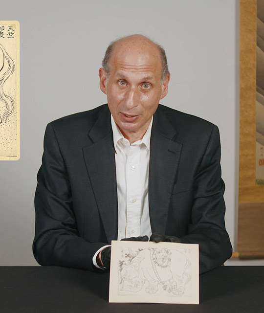 Curator Alfred Haft presents a Hokusai drawing during a 'Curator's corner' episode.