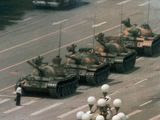 A Chinese man stands alone to block a line of tanks heading east on Beijing&#39;s Cangan Blvd. in Tiananmen Square on June 5, 1989. The man, calling for an end to the recent violence and bloodshed against pro-democracy demonstrators, was pulled away by bystanders, and the tanks continued on their way. The Chinese government crushed a student-led demonstration for democratic reform and against government corruption, killing hundreds, or perhaps thousands of demonstrators in the strongest anti-government protest since the 1949 revolution. Ironically, the name Tiananmen means &quot;Gate of Heavenly Peace&quot;. (AP Photo/Jeff Widener)