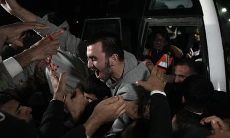 Released Palestinian prisoners arrive in the West Bank town of Ramallah on Tuesday.