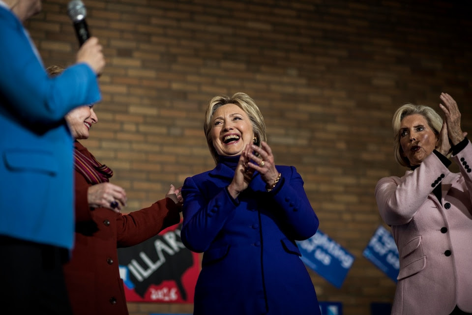 MANCHESTER, NH - Former Secretary of State Hillary Clinton laughs with fellow women lawmakers at a rally in Manchester, New Hampshire on Friday, February 5, 2016. (Photo by Melina Mara/The Washington Post) 