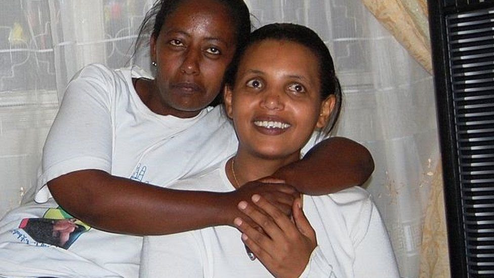 Ethiopian opposition leader Birtukan Mideksa (R) smiles after having returned home in Addis Ababa hours after she was released from jail by Ethiopian authorities on October 6, 2010