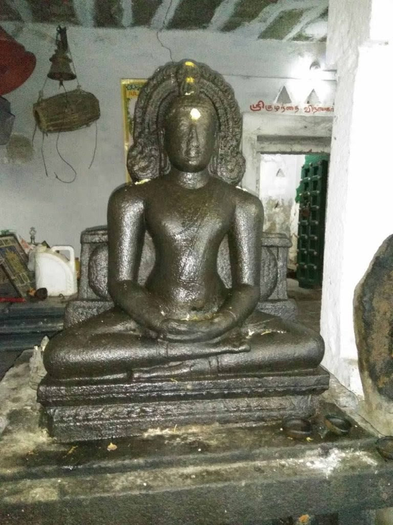 Ancient Buddha statue at Kanikiluppai in the outskirts of Kanchi.