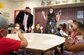 Secretary Cardona with students in classroom in masks