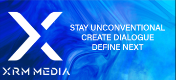 XRM Media sponsor ad. Above a blue gradient, white text overlay reads ‘Stay unconventional. Create dialogue. Define next.’