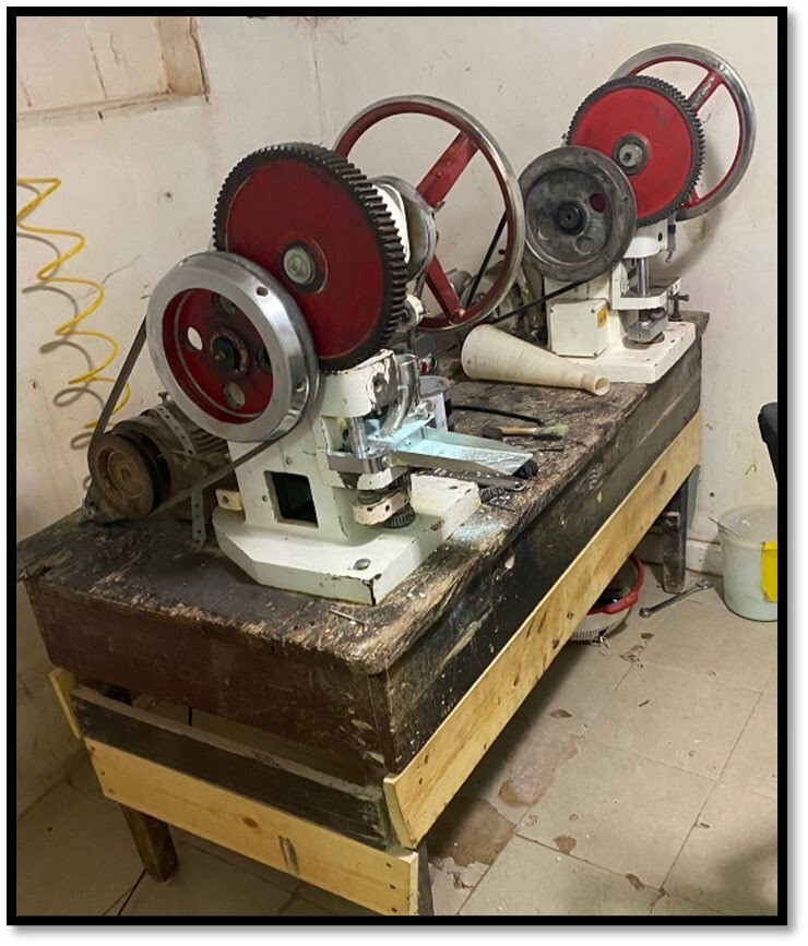 Photo of two of the pill presses found in the fentanyl mill