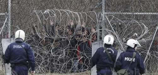 Greek security forces intervene in asylum seekers, who attempt to cross the barbed fence at the closed-off Greek-Turkish border, in Kastanies, Greece on March 04, 2020. - ALLOW IMAGES