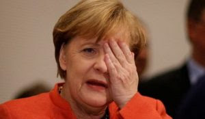 Merkel faces party revolt over UN migration pact