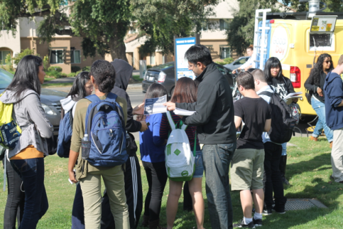 An activist distributes flyers encouraging a "no" vote on Bera at UC Davis campaign event on October 29, 2014.