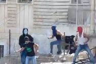 Arab teens hurling rocks and firecrackers at Jewish children in the Jerusalem neighborhood of Ma'ale Zeitim.