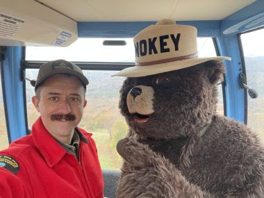 Ranger Martin and Smokey Bear taking a selfie in the gondola