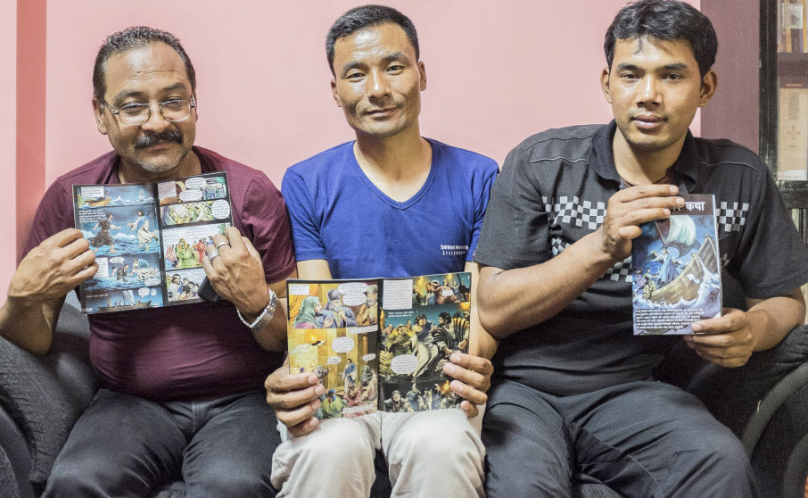  Bimal Shahi, Prakash Pradhan and Shakti Pakhrin, three of eight Christians acquitted, with The Great Story comic book. (CSW, Giulio Paletta)