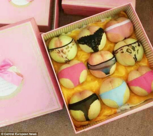 Cheeky: An online fruit business are selling punnets of peaches dressed in lingerie ahead of the Qixi festival, China's version of Valentine's Day