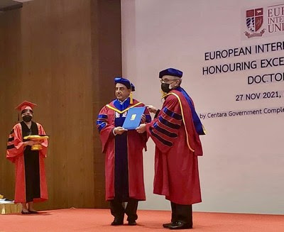 Dr. John Sachtouras receiving his professional doctoral award