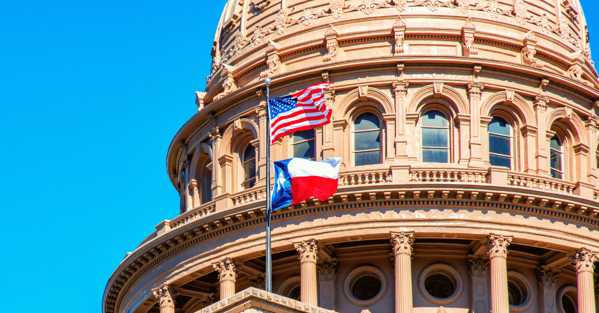 Texas and U.S. Flags Over Capitol Building