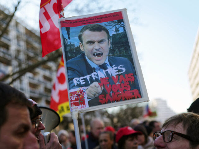 Protesters Demonstrate Against French Pension Reforms LILLE, FRANCE - FEBRUARY 07: A demonstrator holds a panel with a picture of french President Emmanuel Macron reading "pensioners, I will bleed you"as demonstrators march through the streets of Lille in protest of the pension reform on February 07, 2023 in Lille, France. Protests have been taking place across …
