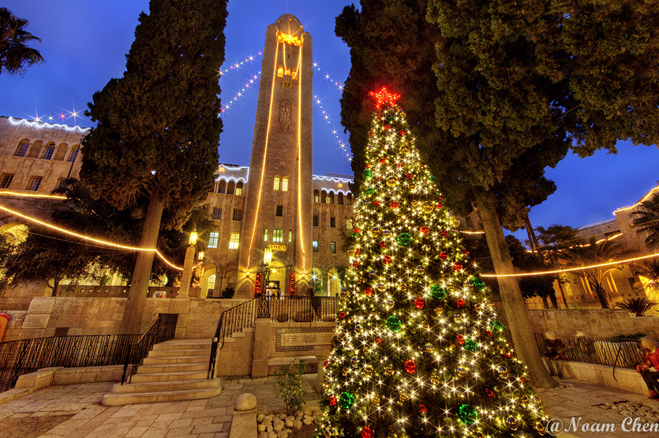 christmas tree and decorations at the YMCA builidng in jerusalem during evening