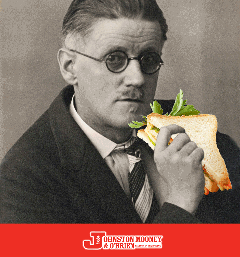 James Joyce eating a sandwich, proving that bad hotel wi-fi will always exist.