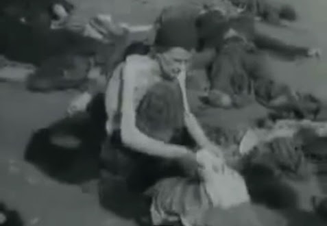 Here                             is a German prisoner of war topless in                             summer 1945 searching clothes on the ground,                             and in the background there is a dead German                             detainee in a gray uniform (3min. 7sec.)