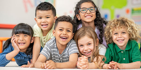 Image of a group of young children smiling